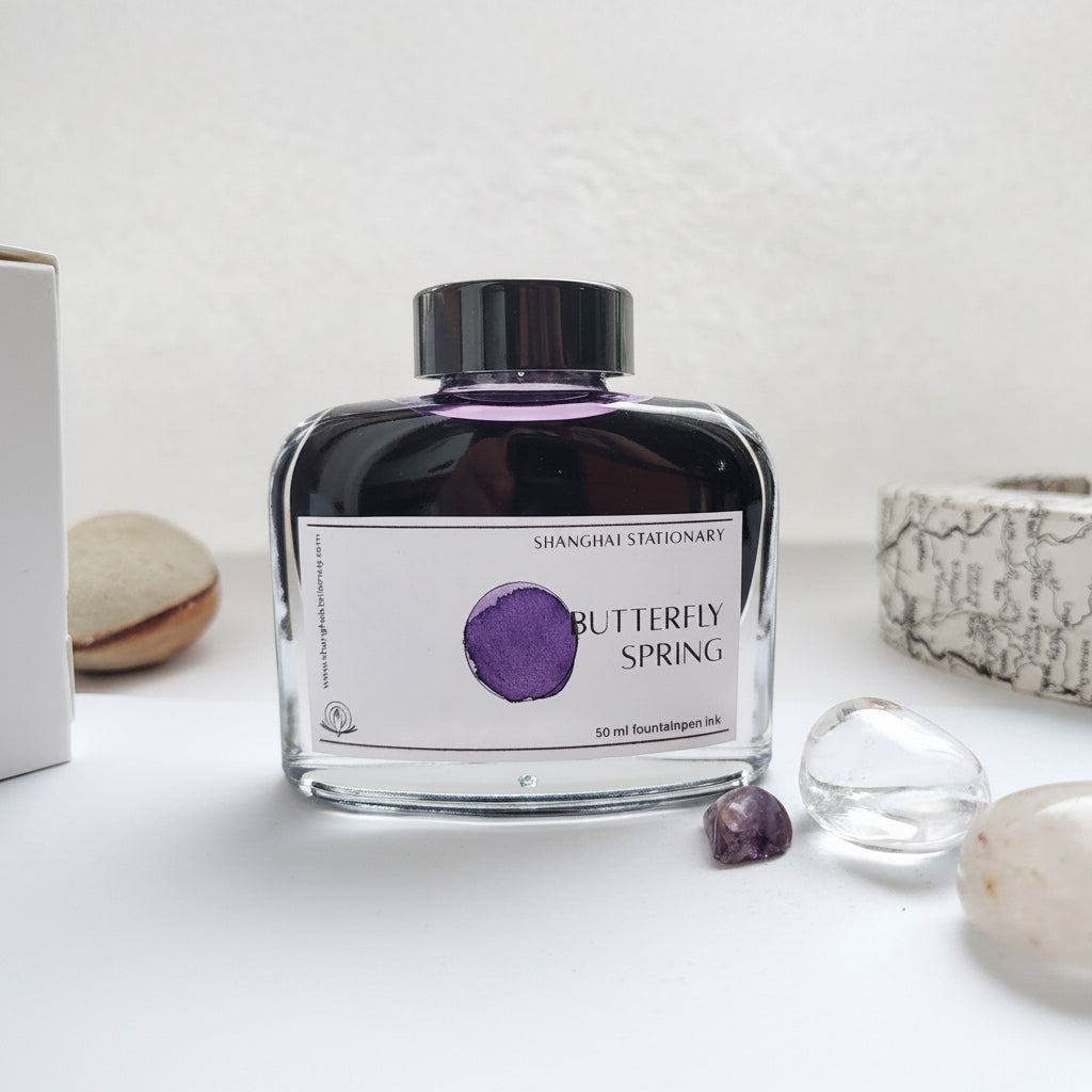 Butterfly Spring bottled fountain pen ink by Shanghai Stationary, violet coloured flower ink swatching, ink bottle