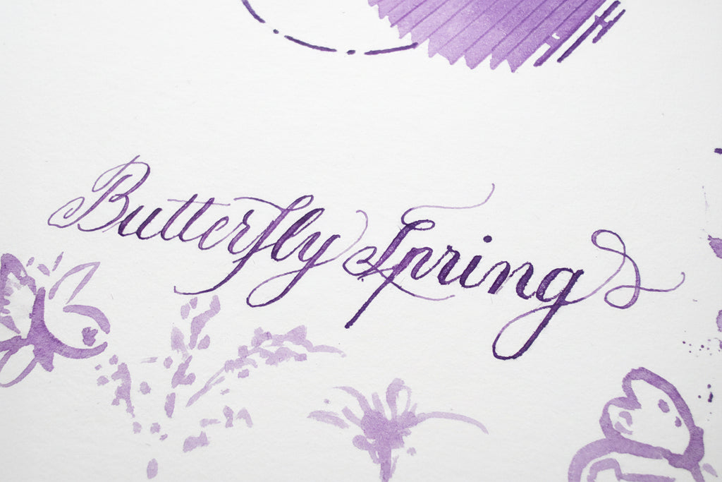 Butterfly Spring bottled fountain pen ink by Shanghai Stationary, violet coloured flower ink swatching, ink bottle