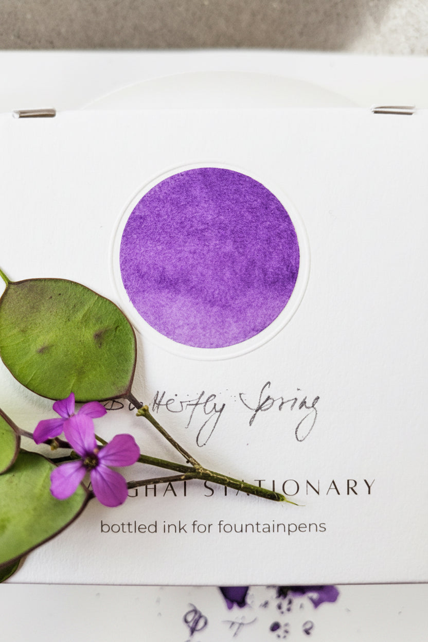 Butterfly Spring bottled fountain pen ink by Shanghai Stationary, violet coloured flower ink swatching, ink bottle, ink swatch