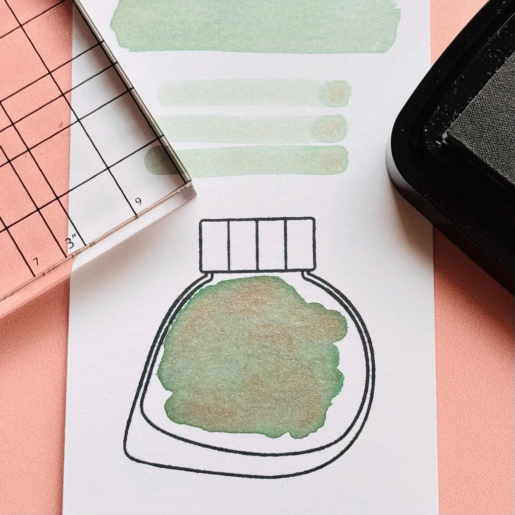 Clear ink stamp set W features 4 ink bottle shaped stamps based on the fountain pen ink brand Kitty Ink Pot. Clear Ink Bottle Shaped Stamps for fountain pen ink swatching & creative journaling.